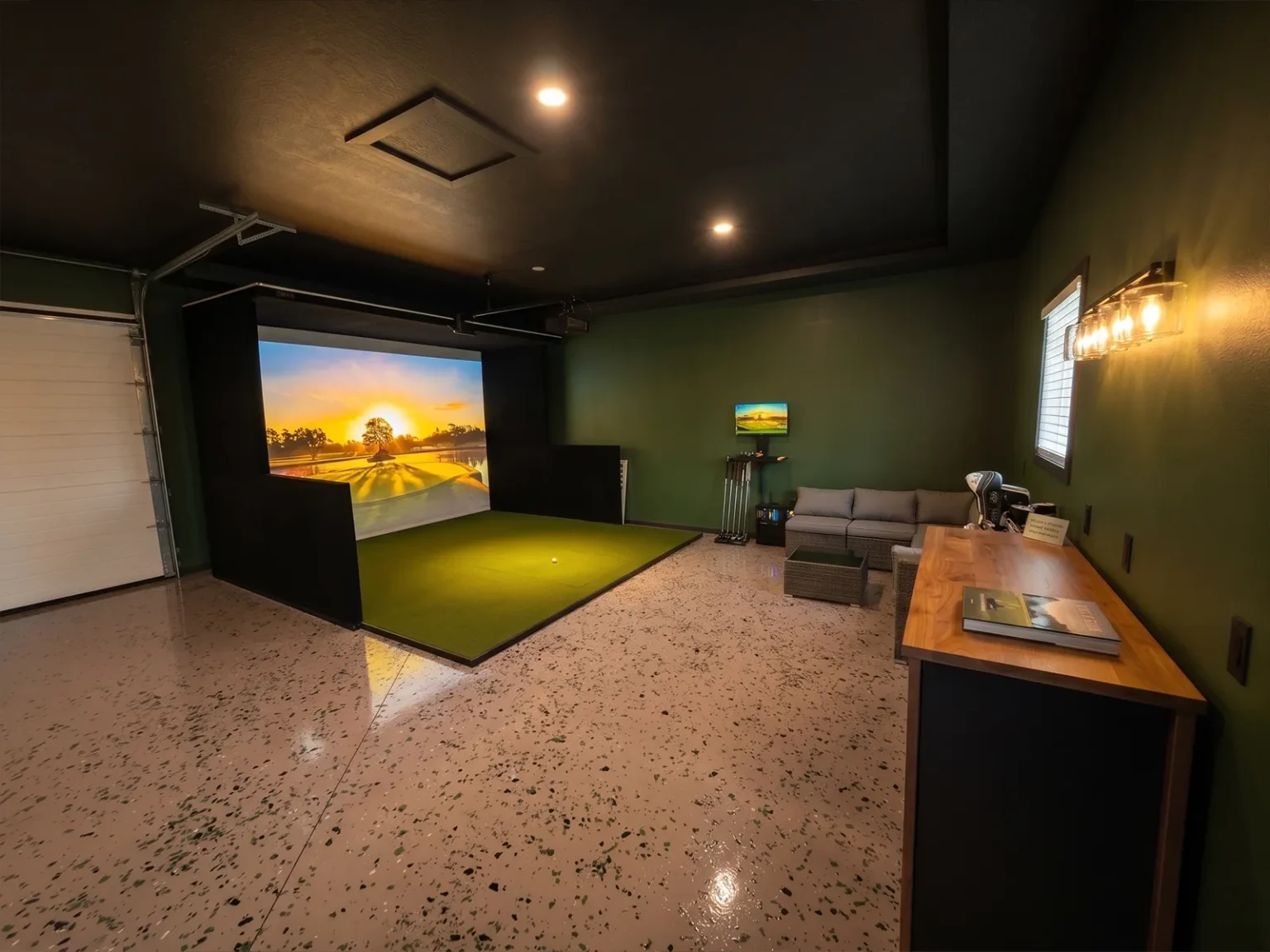 SimBooth 2 golf simulator enclosure installed in a finished garage in Carlyle, Saskatchewan