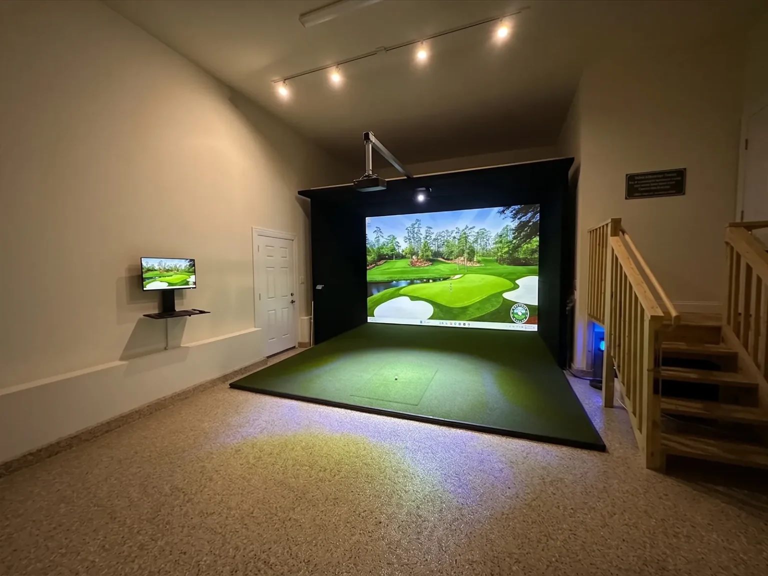 SimBooth 3 pre-engineered golf simulator enclosure installed in a Calgary garage